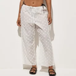 Beach pant with pom-poms