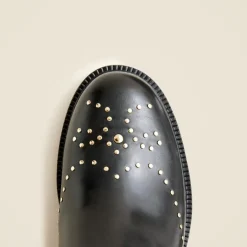 Chelsea wing tip boots in studded leather